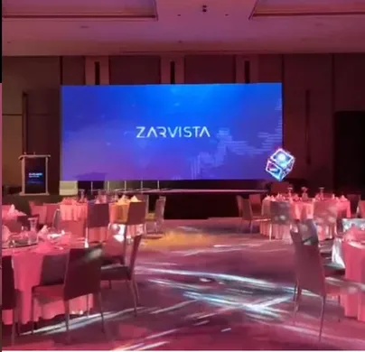 LED screen showing Zarvista branding at a dinner